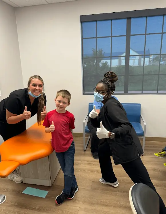 A happy patient with the Paris Children’s Dentistry team
